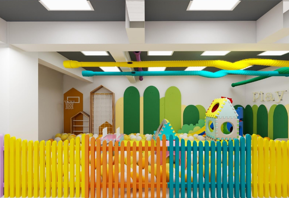 Soft-play area with colourful fence and ball pit